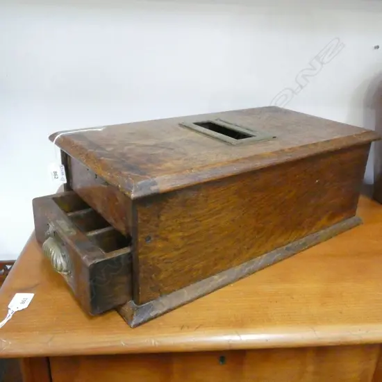 AN ANTIQUE OAK CASH DRAWER