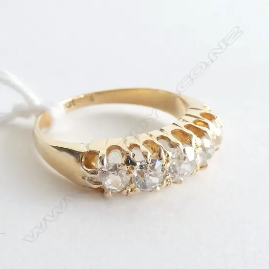 18CT GOLD AND FIVE STONE DIAMOND RING