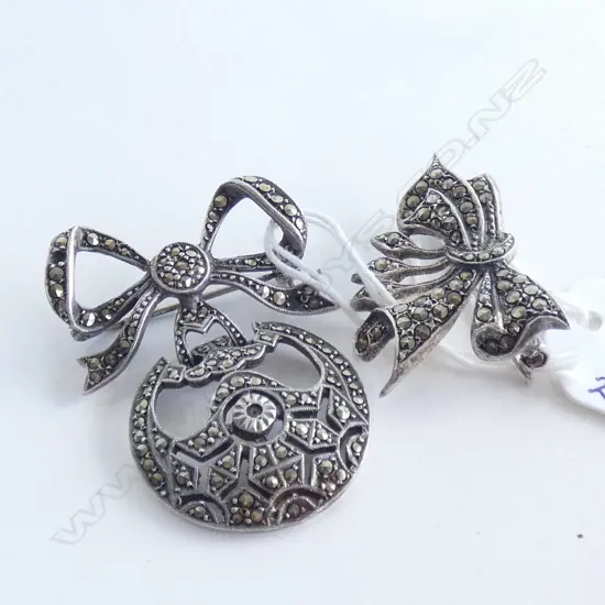 TWO SILVER AND MARCASITE BROOCHES