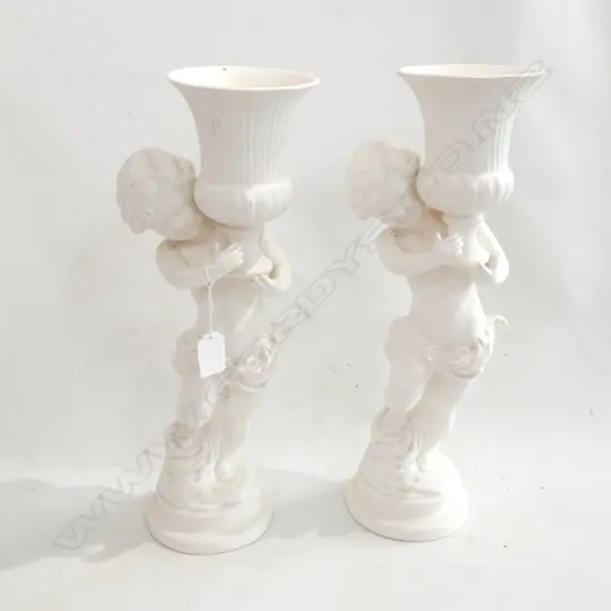 PR WHITE CERAMIC VASES; CHERUBS HOLDING URNS H.400mm