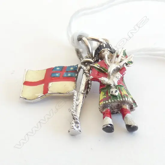 TWO VINTAGE SILVER AND ENAMEL CHARMS