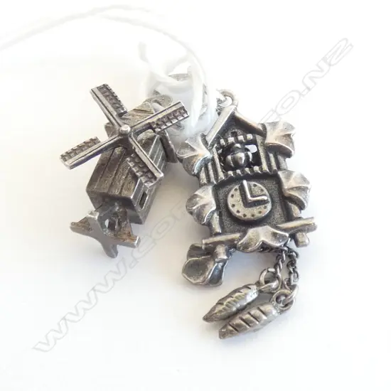 TWO VINTAGE SILVER CHARMS