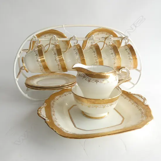 21 PCE AYNSLEY WHITE & GILT TEA SET ON RACK; 6 TRIOS / MILK / SUGAR / PLATE 