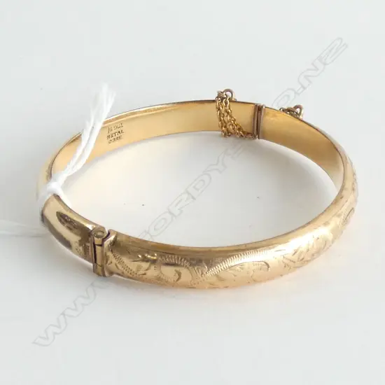 9CT  LINED ON METAL CORE  HINGED BANGLE