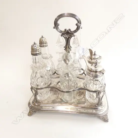 8 PCE SILVER PLATE & GLASS CRUET SET; SILVER PLATE STAND + 7 CONTAINERS