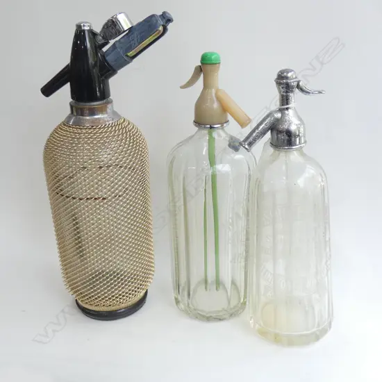 3 VINTAGE SODA SYPHON BOTTLES; 1 WITH MESH COVER (LARGEST H 380MM