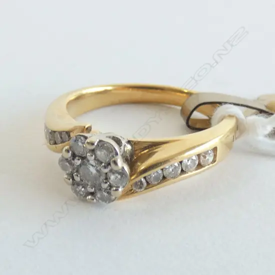 18CT DIAMOND CLUSTER RING (TICKET $1400)