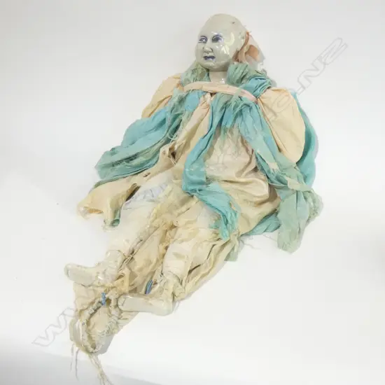 OLD DOLL - GLAZED PORCELAIN HEAD, HANDS & FEET - CLOTH BODY. CLOTHES IN DISREPAIR - NO HAIR L640MM