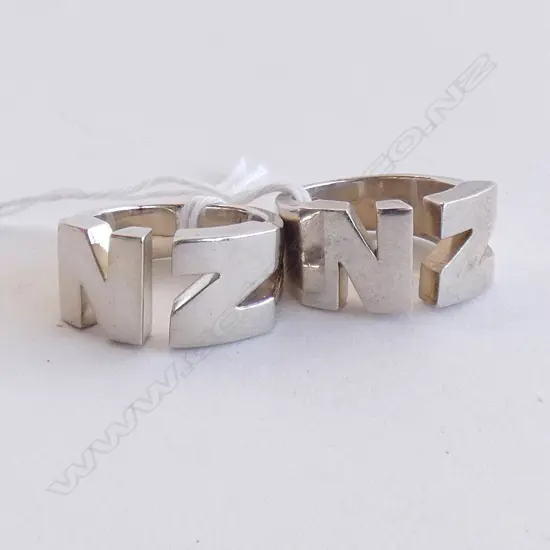 TWO SILVER 'NZ' RINGS