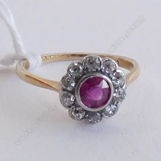 18CT GOLD RUBY ? AND DIAMOND CLUSTER RING