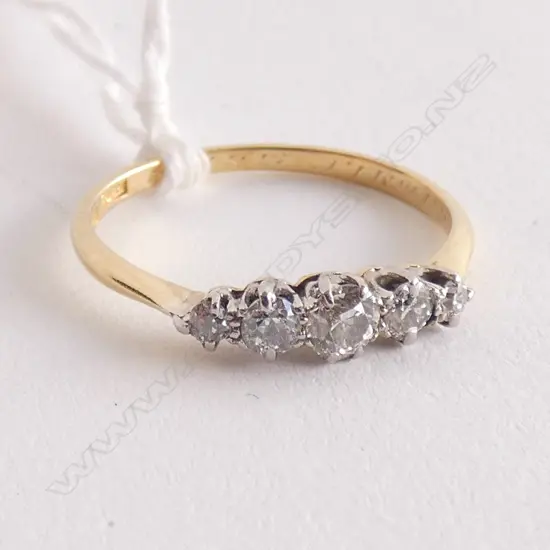 18CT GOLD AND FIVE STONE DIAMOND RING