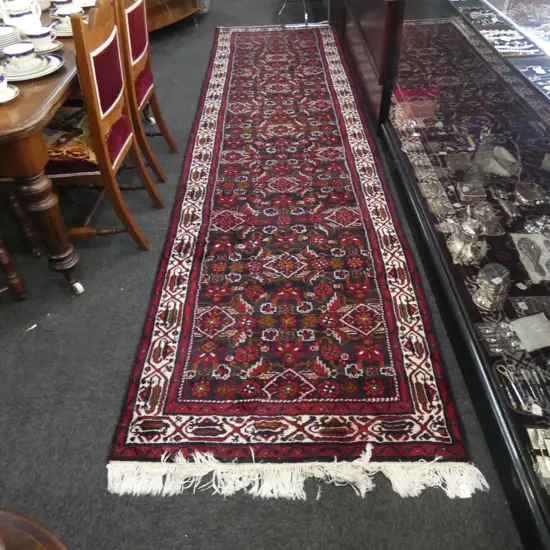 LG RED HAND WOVEN WOOL RUG