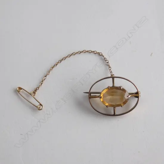 9CT YELLOW STONE BROOCH 25mm W. 3.35gms