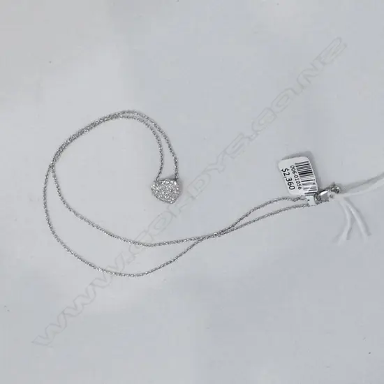 18CT WHITE GOLD PAVE DIAMOND SET HEART PENDANT AND 9CT GOLD CHAIN