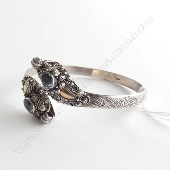 SILVER DOUBLE DRAGON HEADED BANGLE W AQUAMARINES?