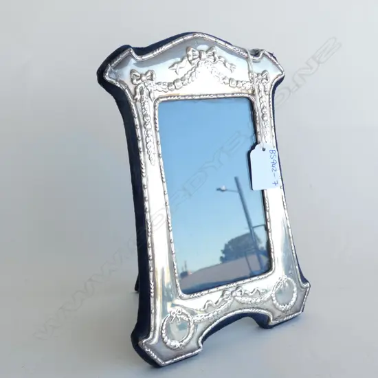 VINTAGE STG SILVER PHOTO FRAME EMBOSSED WITH BOWS & SWAGS (DAMAGE TO ONE CORNER) 225 X 160MM