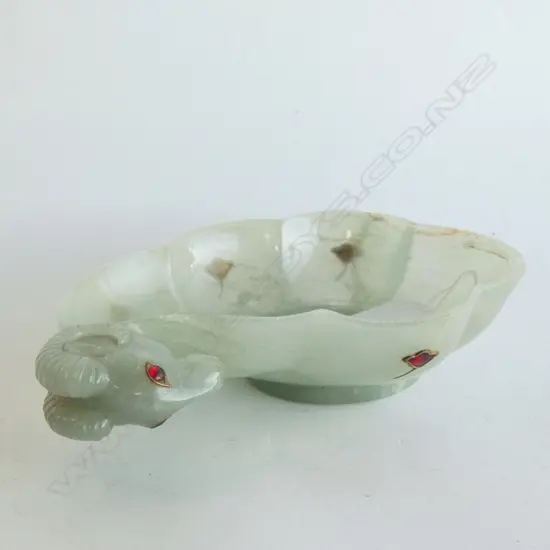 MUGHAL-STYLE RAM'S HEAD BOWL, POSSIBLY GLASS INSET WITH RED ENAMEL CABACHONS. LENGTH 180mm.