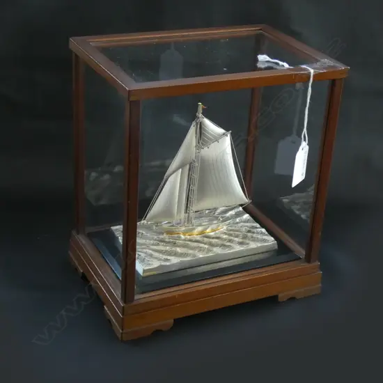 STERLING SILVER YACHT BY TAKEHIKO IN GLASS CASE.
