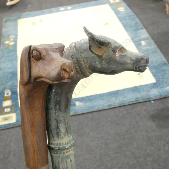 2 WALKING STICKS; CARVED WOODEN DOG HEAD & BRONZE BUFFALO L.950mm