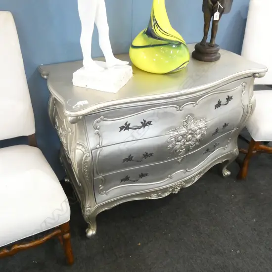 A LOUIS STYLE CARVED BOMBE COMMODE w. SILVER WASH PAINT & BRASS HANDLES
