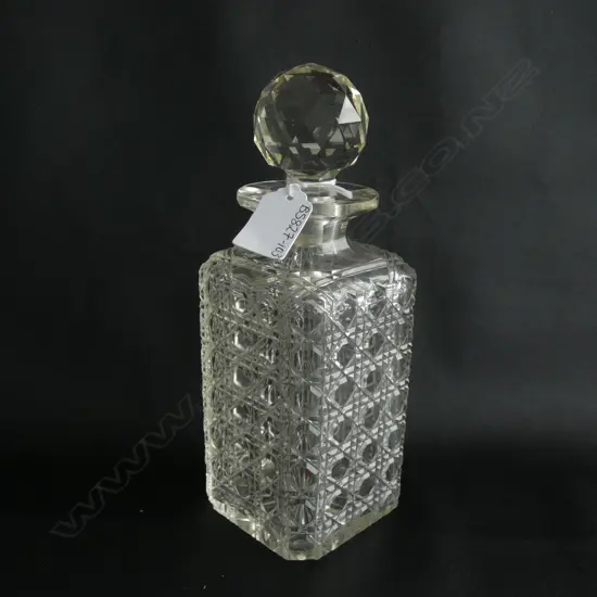 CUT GLASS DECANTER WITH STOPPER H. 235MM SOME CHIPPING TO END OF STOPPER