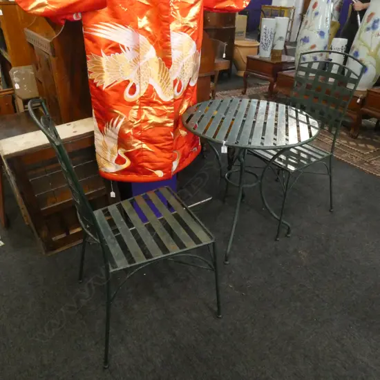GREEN PAINTED METAL PATIO SET; TABLE DIA 700MM & 2 CHAIRS. SOME WEAR TO PAINT