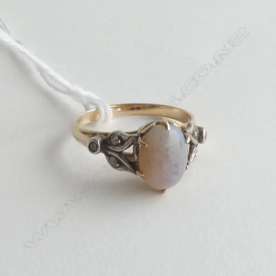 OPAL & DIAMOND SET RING IN UNMARKED 9CT GOLD