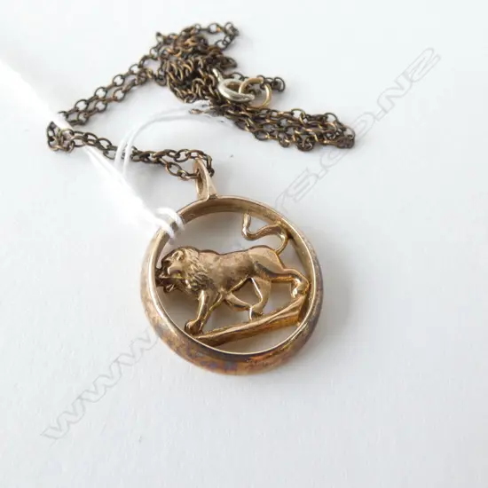 9CT LION PENDANT  3.6 GRAMS ON METAL CHAIN