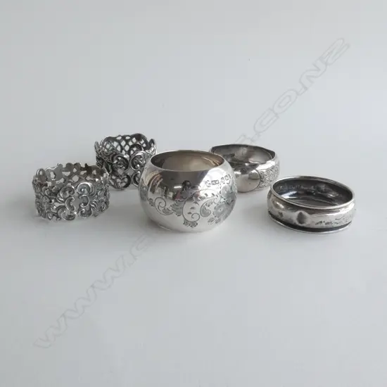 5 ASST STG SILVER NAPKIN RINGS 