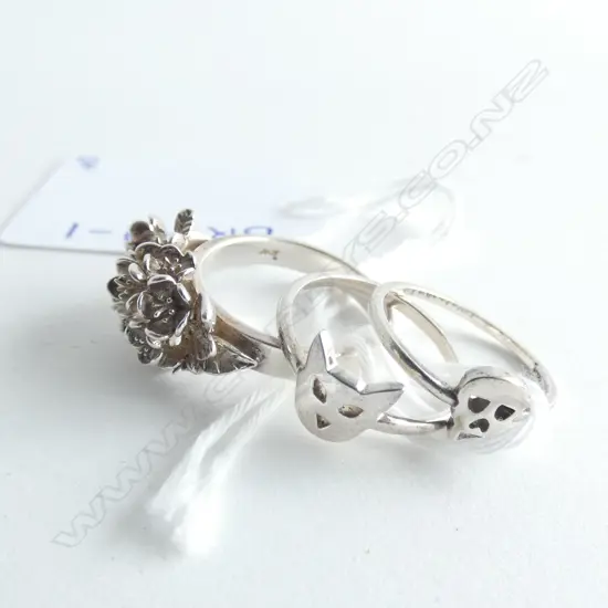 Three silver Karen Walker rings