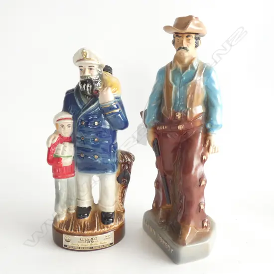 2 CERAMIC ALCOHOL DECANTERS; 'DAKOTA COWBOY' H.350mm + JIM BEAN SEA CAPTAIN