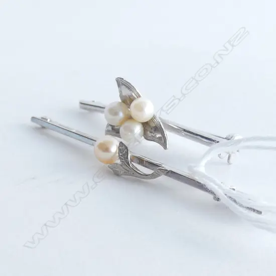 TWO SILVER AND PEARL BROOCHES