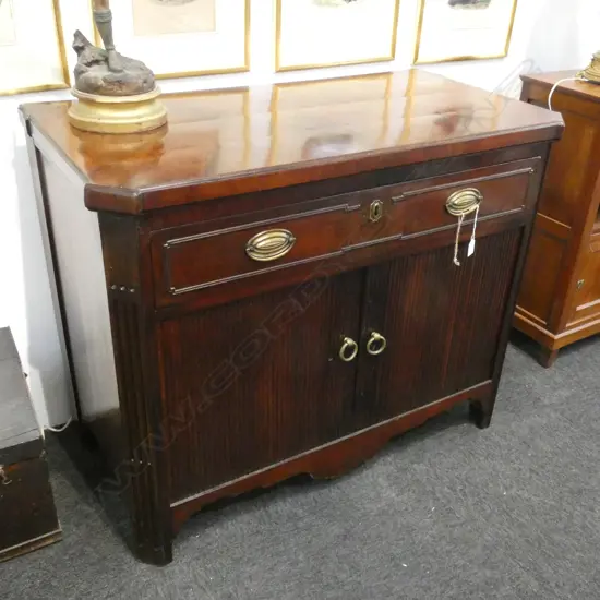 REGENCY MAHOGANY TAMBOUR FRONT CUPBOARD...