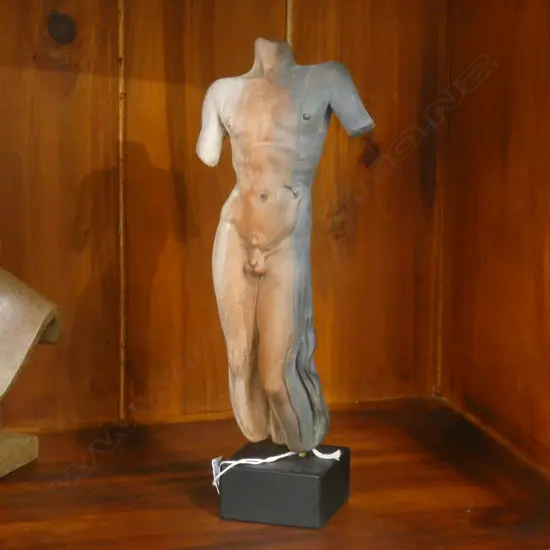 SIGNED POTTERY SCULPTURE -NAKED MALE ON WOODEN STAND H 260mm.