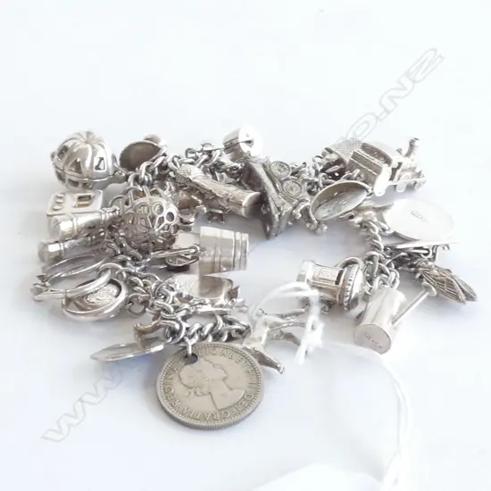 SILVER CHARM BRACELET - 35 CHARMS 70gms