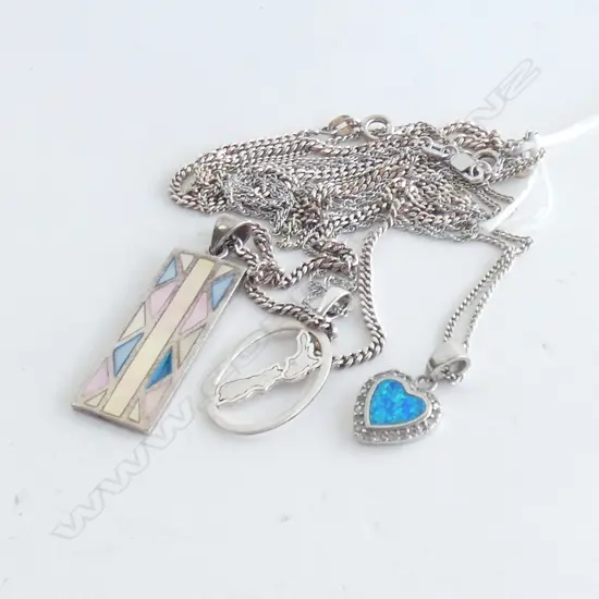 THREE SILVER CHAINS AND SILVER PENDANTS