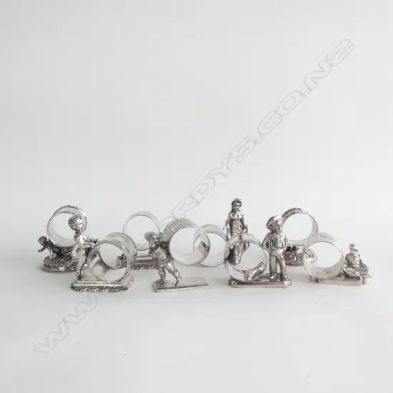 8 ASST VINTAGE SILVER PLATE NOVELTY NAPKIN RINGS; CHERUBS / FIGURES ETC..