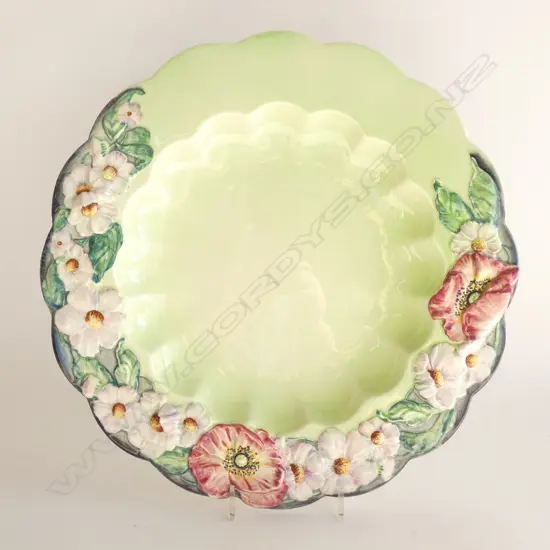 A CARLTON WARE EMBOSSED CHARGER. Dia.305mm