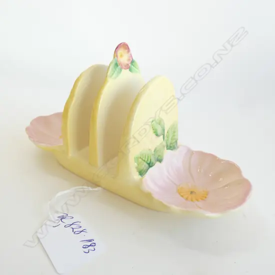 A CARLTON WARE EMBOSSED TOAST RACK, Frit to rose knop