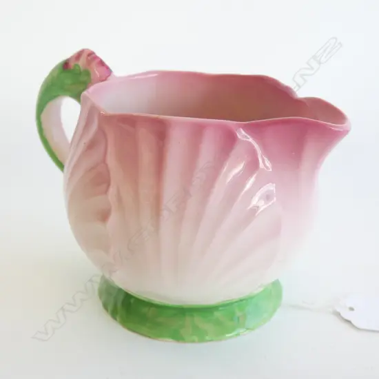 A CARLTONWARE EMBOSSED PINK BUTTERCUP JUG. H.95mm