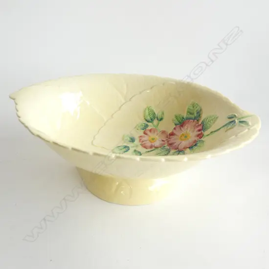 A CARLTON WARE EMBOSSED SALAD BOWL, YELLOW GROUND, WILD ROSE PATTERN. W.280mm…