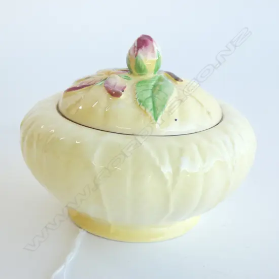 A CARLTONWARE EMBOSSED HONEY POT AND COVER, YELLOW APPLE BLOSSOM. Dia.100mm