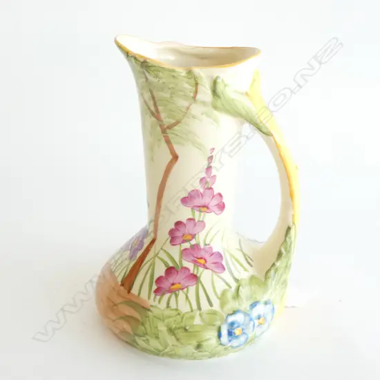 A WOODS (H J WOODS) JUG, GARDEN SCENE WITH FLOWERS AND TREE. H.180mm