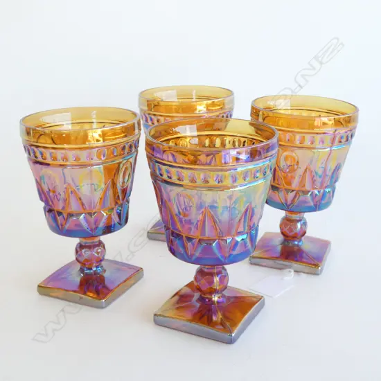 FOUR DEPRESSION GLASS WINE GOBLETS, ON SQUARE PEDESTAL BASES. COLOUR SIMILAR TO MARIGOLD