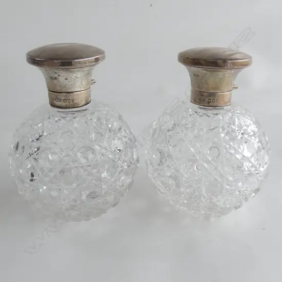 PAIR CUT CRYSTAL PERFUME BOTTLES W SILVER TOPS, LONDON 1904. H.120mm.