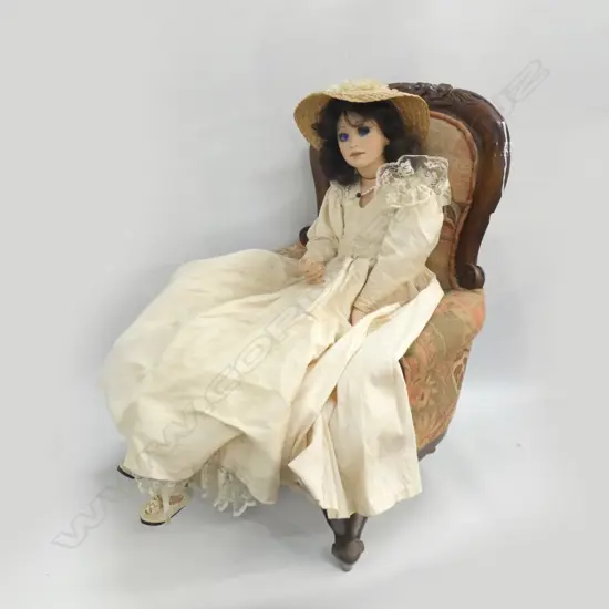 DOLL IN CHAIR