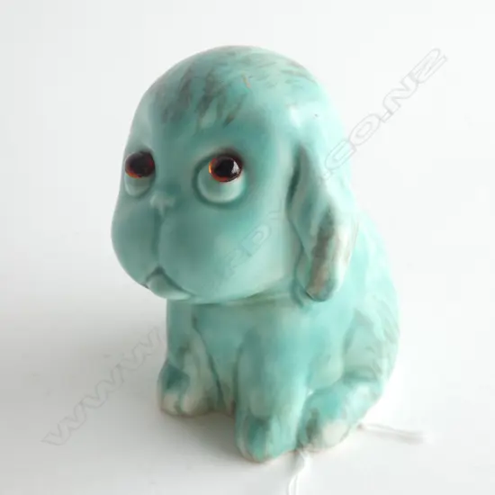 A Crown Devon seated dog