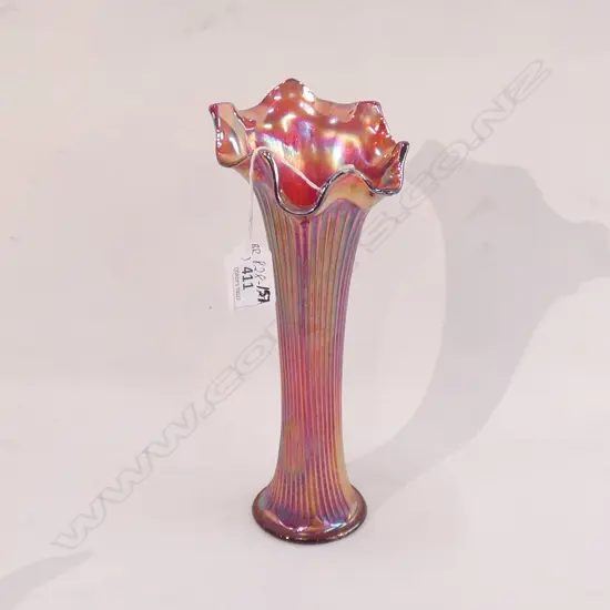A red, slender Carnival Glass vase