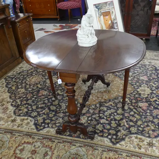 EDWARDIAN MAHOGANY DROP SIDE TABLE ON CASTORS 1000 X 1035MM