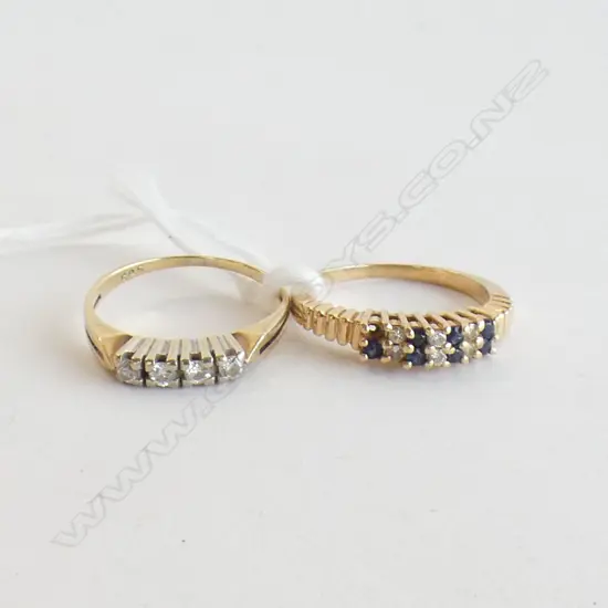 2 14K GOLD RINGS. 1 W 4 DIA'S. 1 W 6 DIA'S & 8 SAPPHIRES 1 MISSING 4GMS